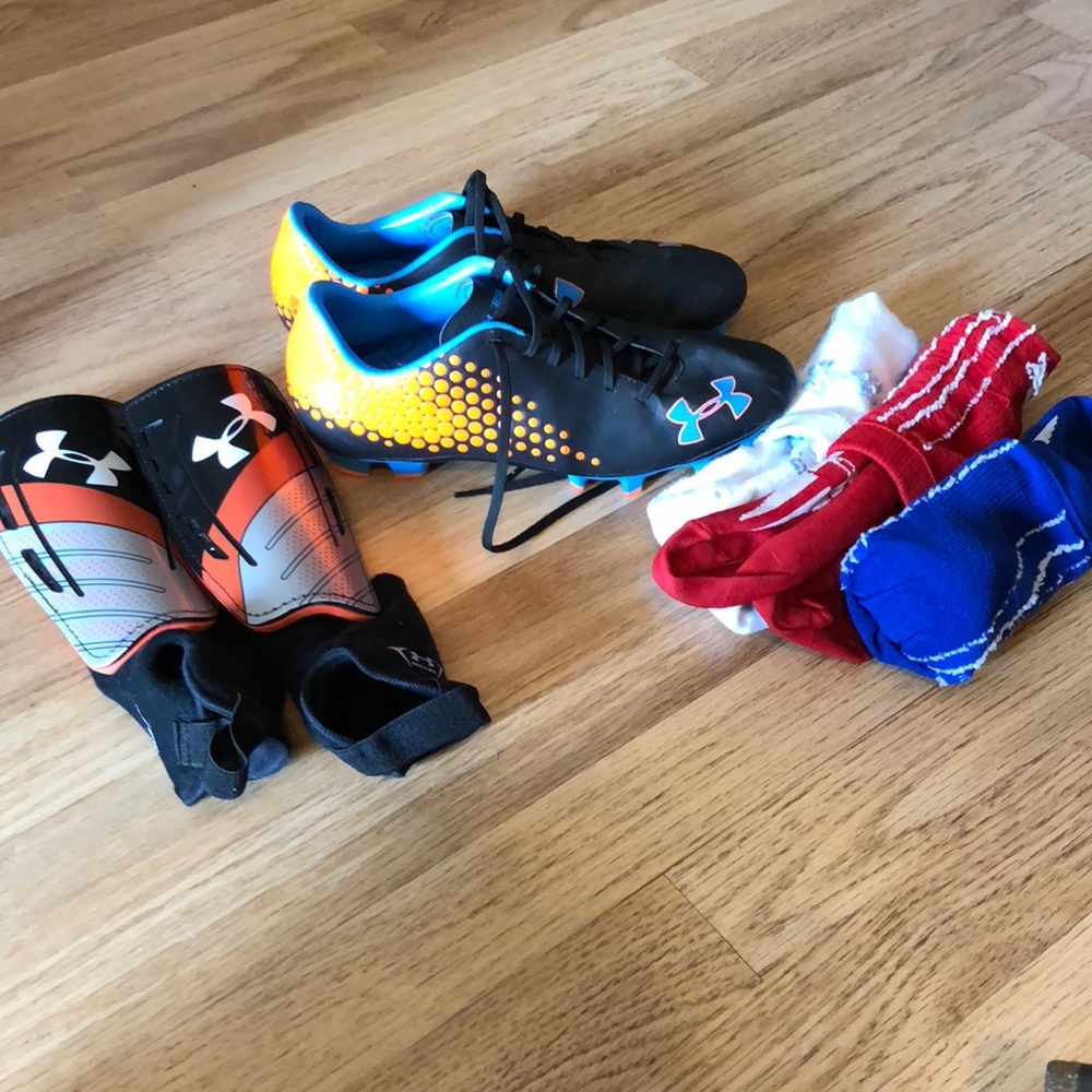 soccer cleats, shin guards, and 3 pairs of socks